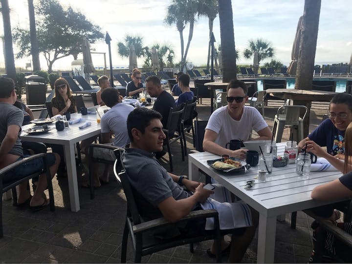 Teammates gather around the breakfast table during Help Scout’s Fall 2018 retreat to Hilton Head, SC.